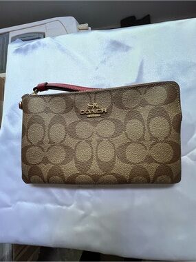 Coach Brown Signature Canvas Wristlet with Pink Strap